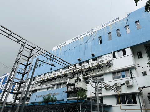 Super Specialty Hospital side view with Bengali signage